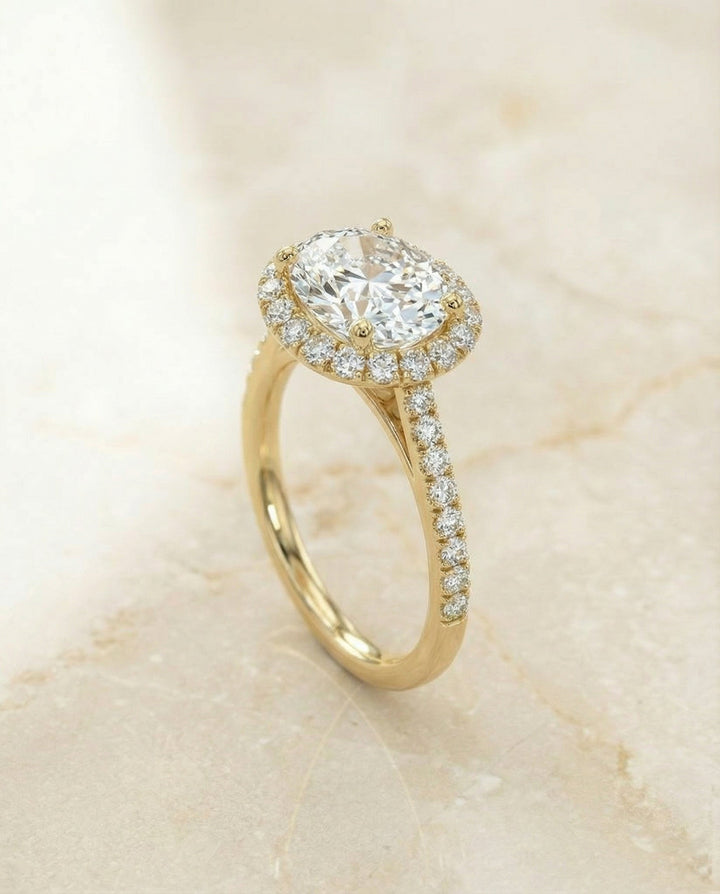 Petite French Pavé Halo Oval, in 18K Yellow Gold, pave setting – angled view | RockHer
