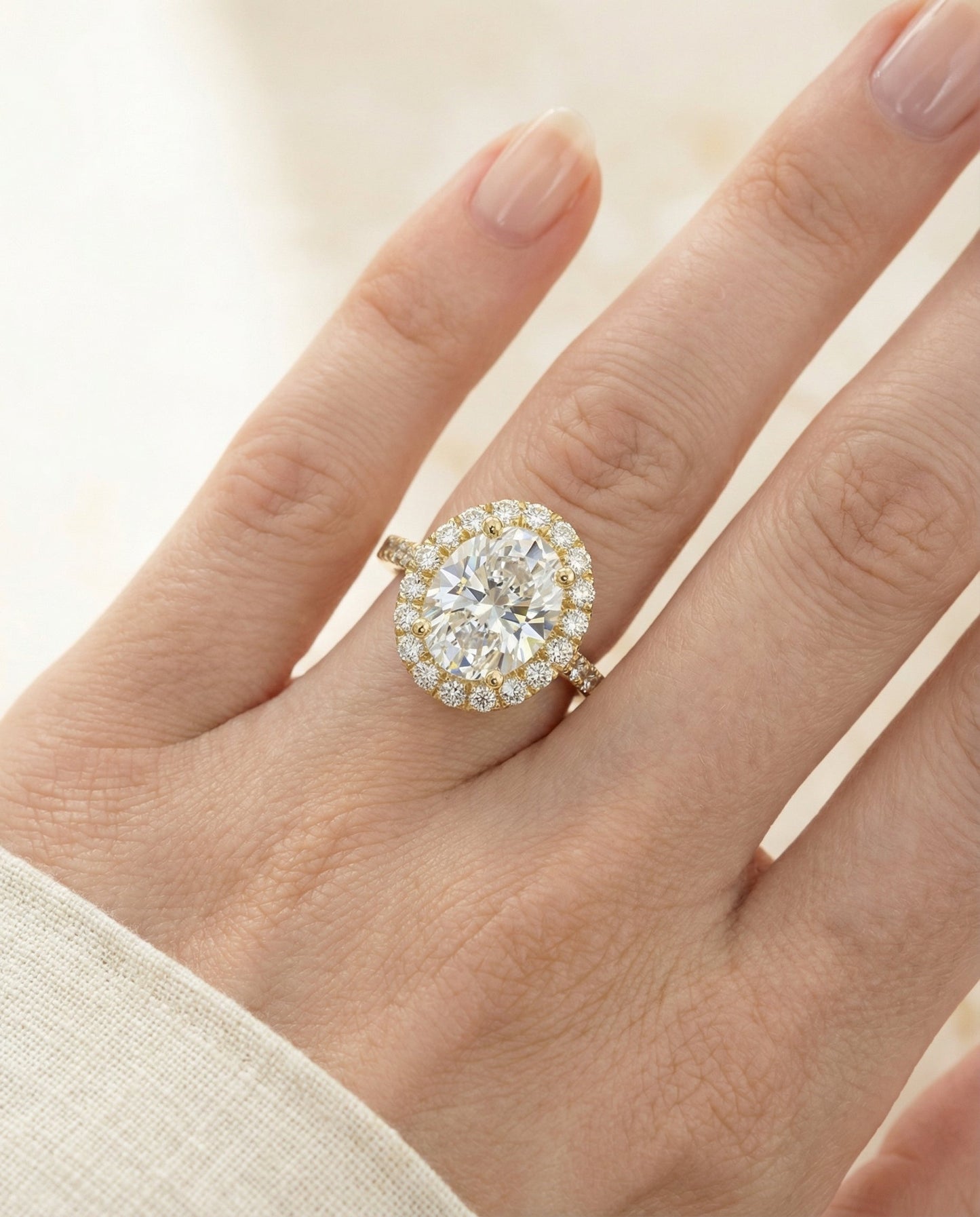 Dylan Select Petite French Pavé Halo Oval Engagement Ring, in 18K Yellow Gold, pave setting – lifestyle shot | RockHer
