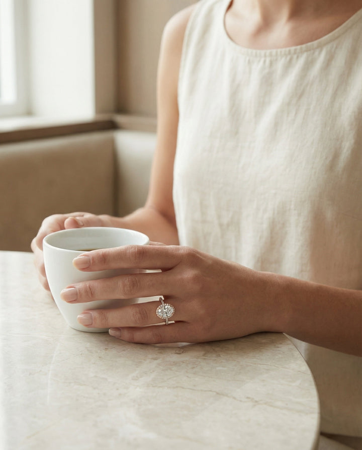 Dylan Select Petite French Pavé Halo Oval Engagement Ring, in 14K Rose Gold, pave setting – lifestyle shot | RockHer