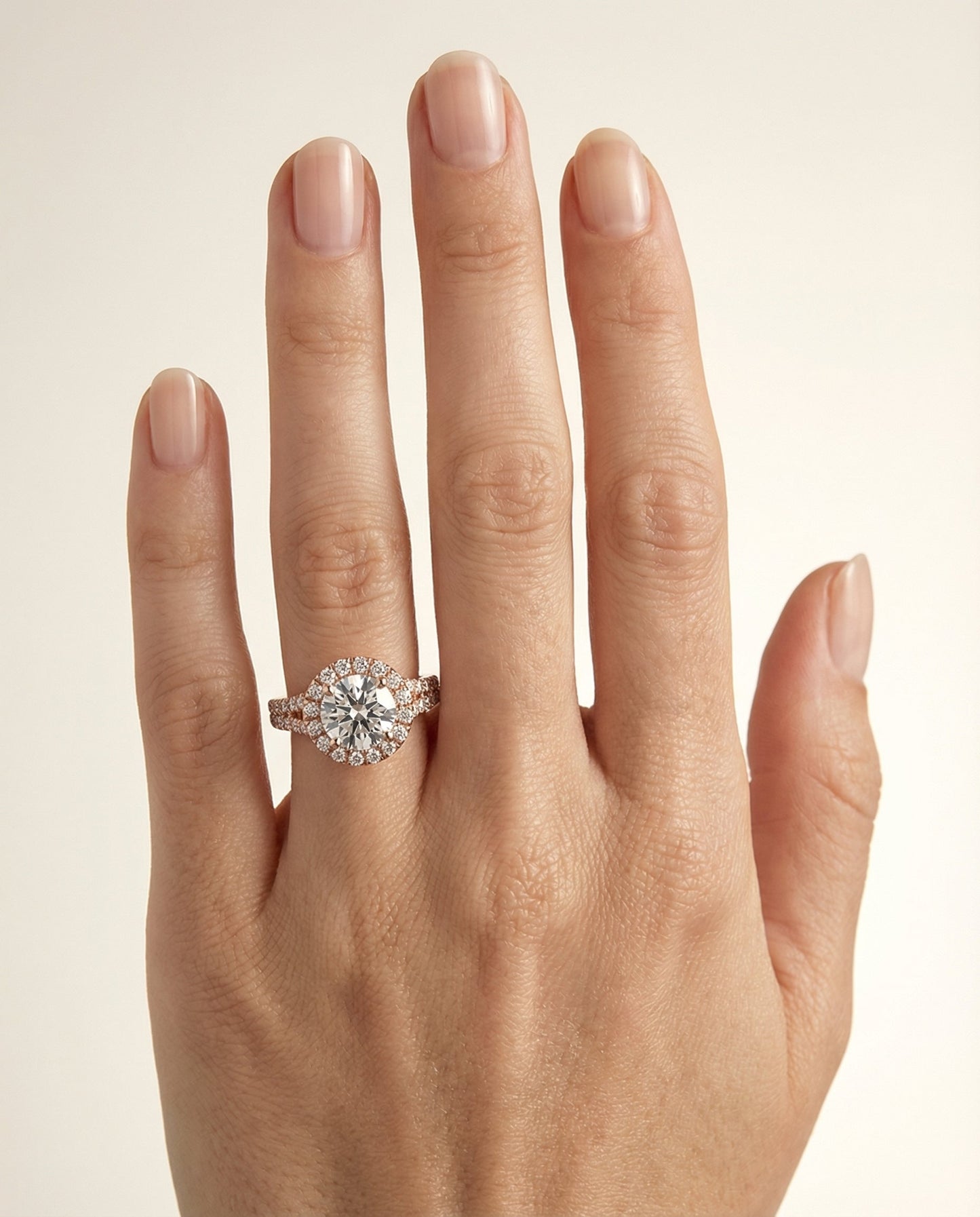 Round Brilliant, Petite Split Shank Halo, in 14K Rose Gold, pave setting – lifestyle shot | RockHer