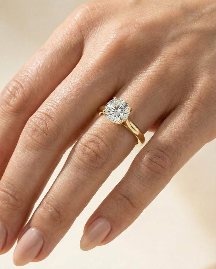 Round Brilliant, Pinched Cathedral Solitaire, in 18K Yellow Gold, prong setting – lifestyle shot | RockHer