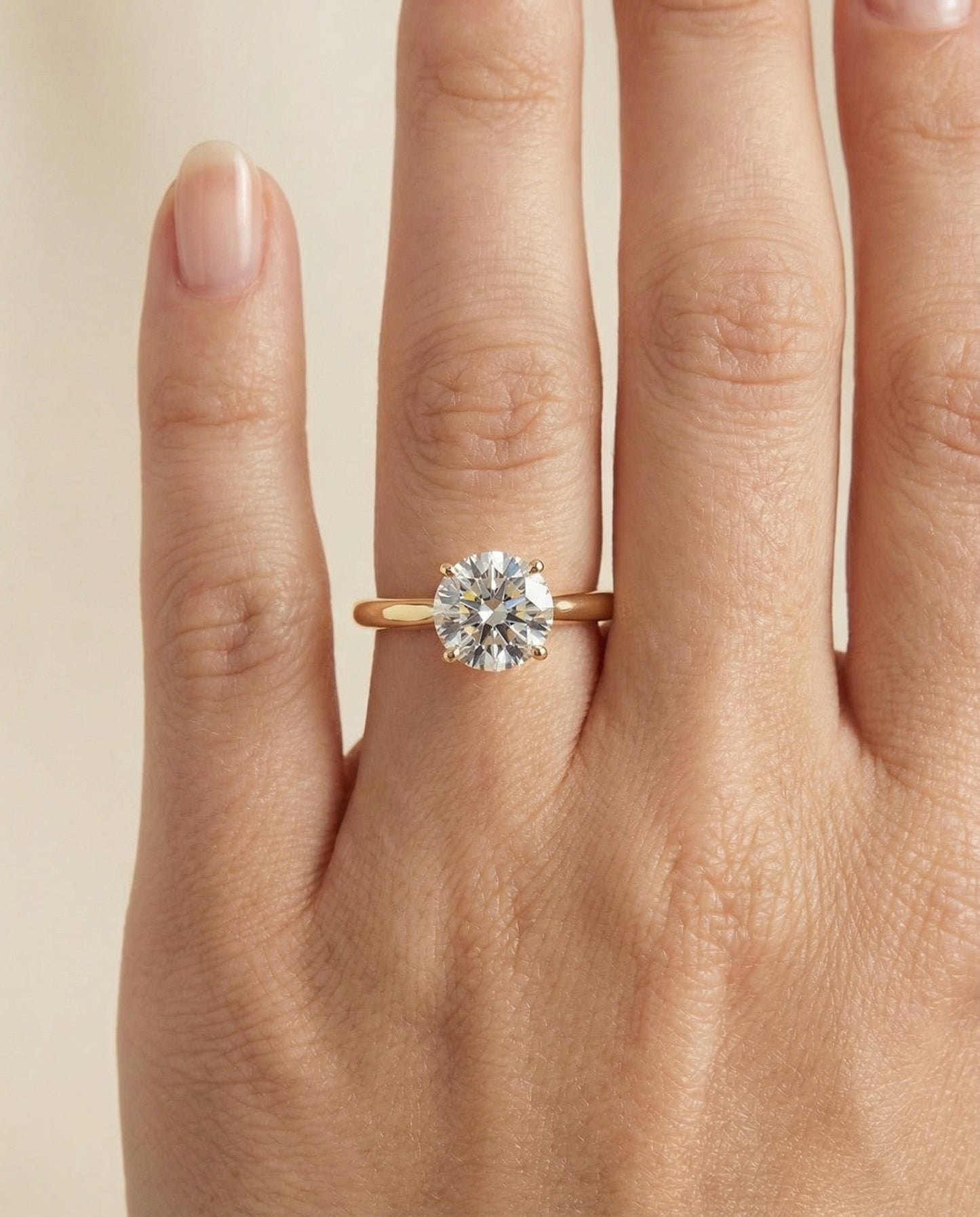 Round Brilliant, Pinched Cathedral Solitaire, in 18K Yellow Gold, prong setting – lifestyle shot | RockHer