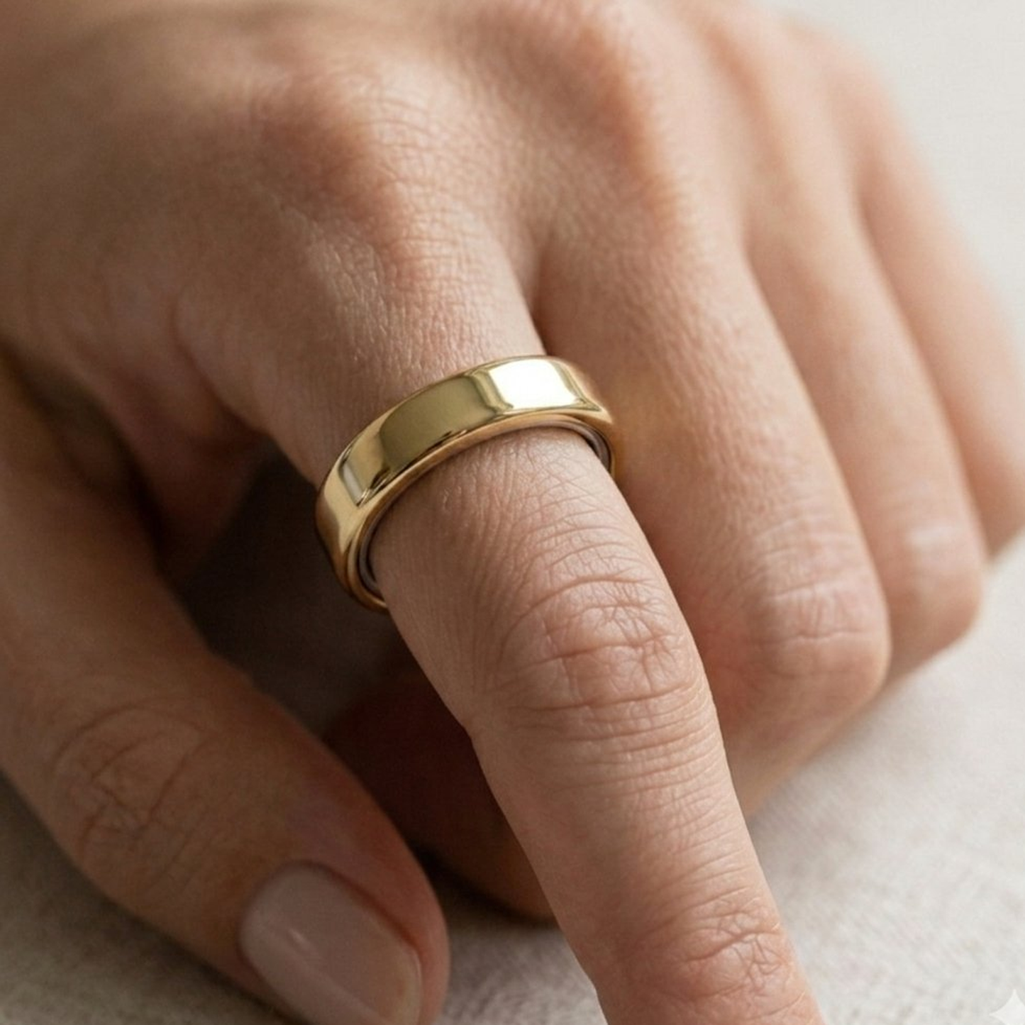 Polished Gold Cover for Oura Ring, in 14K Yellow Gold – lifestyle shot | RockHer