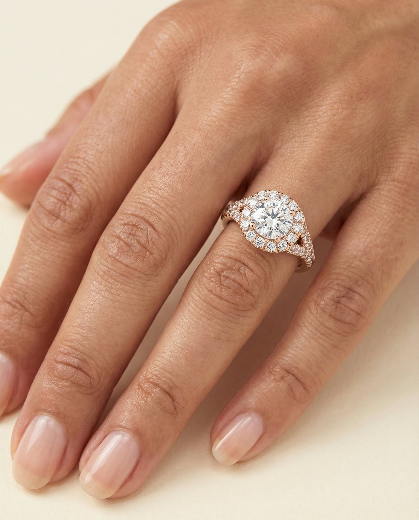 Prong Halo Split Shank Cushion, in 14K Rose Gold, pave setting – lifestyle shot | RockHer