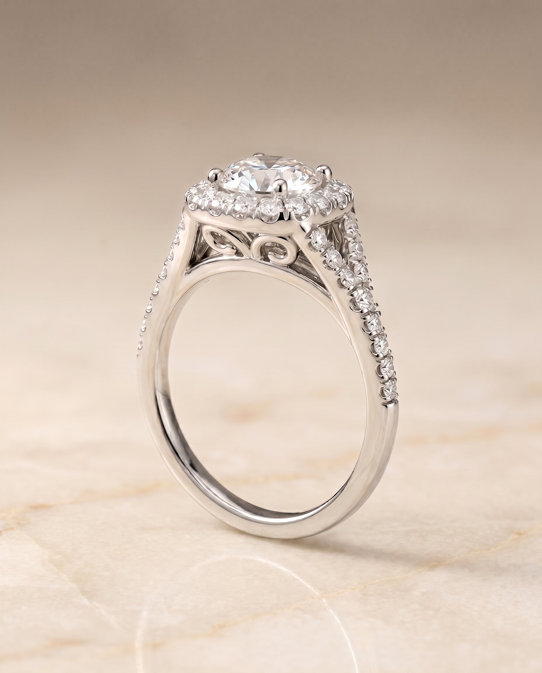 Prong Halo Split Shank Cushion, in Platinum, pave setting – angled view | RockHer