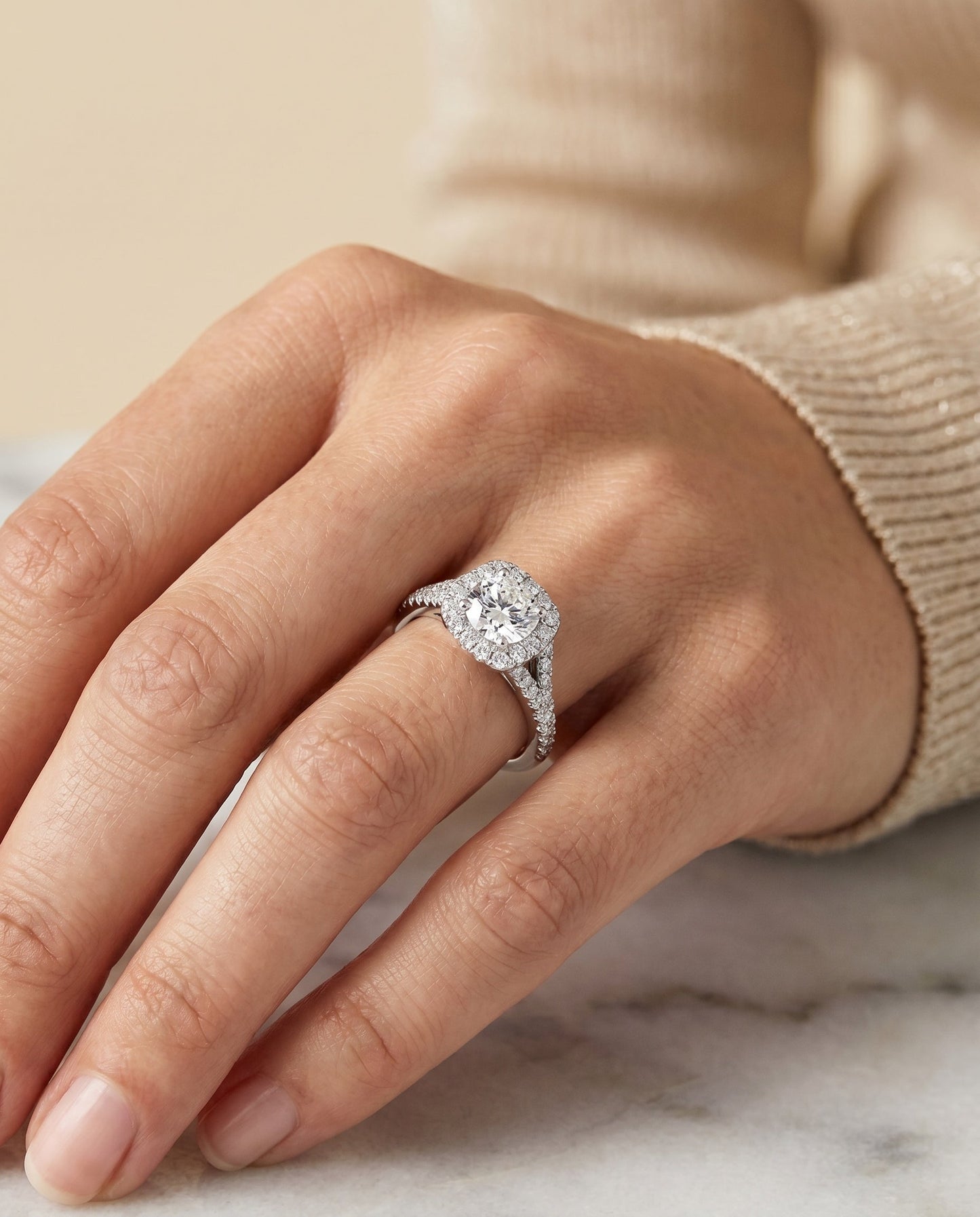 Prong Halo Split Shank Cushion, in Platinum, pave setting – lifestyle shot | RockHer
