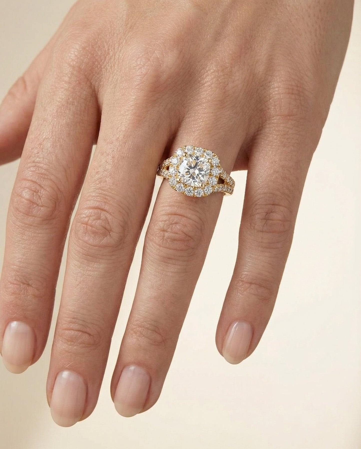 Prong Halo Split Shank Cushion, in 18K Yellow Gold, pave setting – lifestyle shot | RockHer