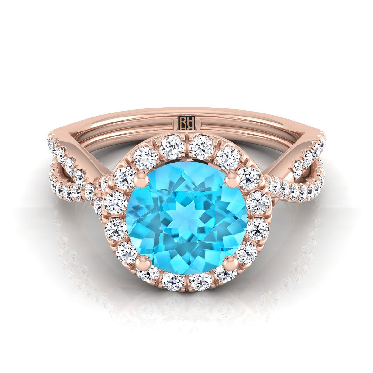 แหวนหมั้นทองคำ 14K ชมพู ทรงกลม ประดับทับทิมสวิสสีน้ำเงิน ทรงบิดขอบหยัก ประดับเพชรพาเว่ ฮาโล - 1/2 กะรัตรวม