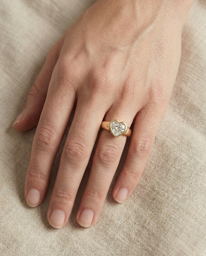 The Remi Select — Bezel-Set Cigar Band Heart in 18K Yellow Gold