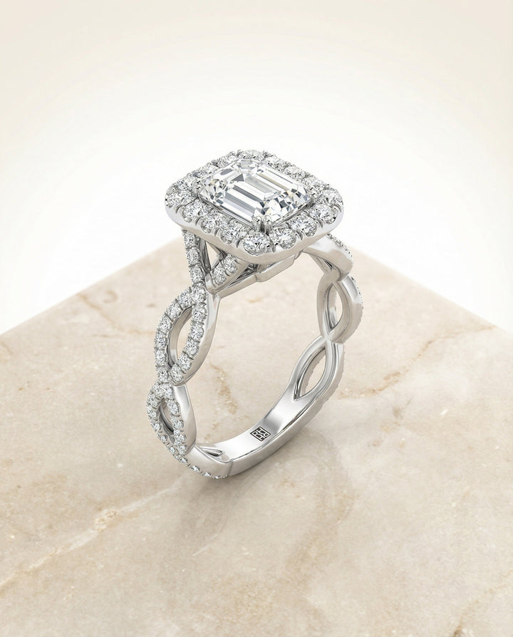European Cut, Ribbon Twist Pavé Halo Emerald, in Platinum, pave setting – angled view | RockHer