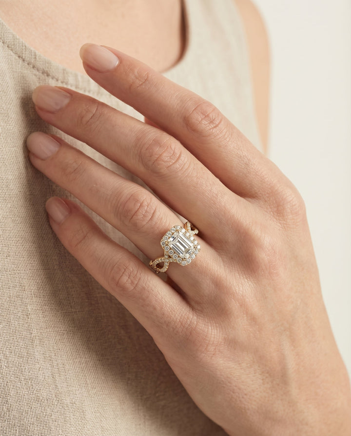 European Cut, Ribbon Twist Pavé Halo Emerald, in 18K Yellow Gold, pave setting – lifestyle shot | RockHer