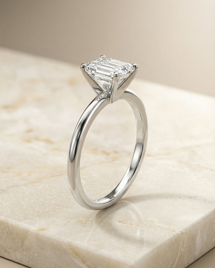 European Cut, Round Comfort Fit Claw Prong Solitaire Emerald, in 18K White Gold – front view | RockHer