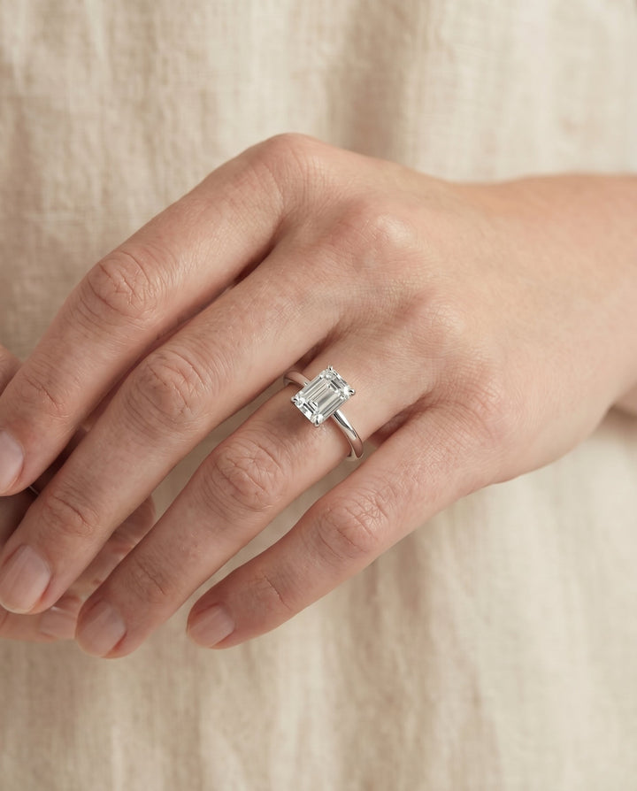 European Cut, Round Comfort Fit Claw Prong Solitaire Emerald, in Platinum – lifestyle shot | RockHer