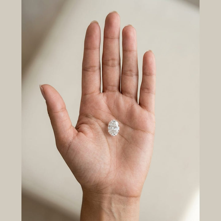 1-1/4 Carat Oval Lab Grown Diamond — true-scale on open palm