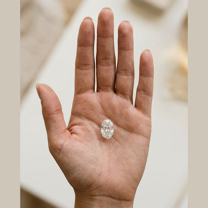 1-1/2 Carat Oval Lab Grown Diamond — true-scale on open palm