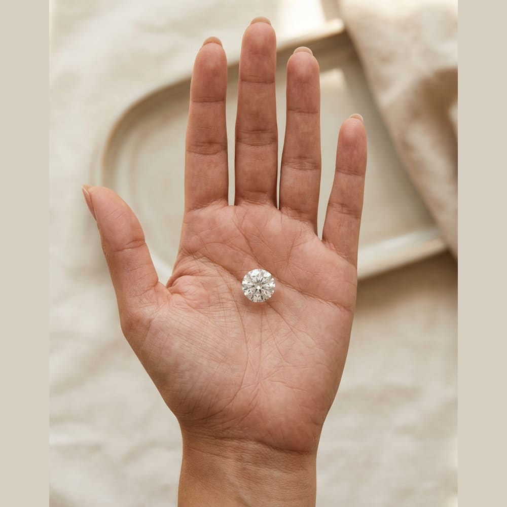 1-1/4 Carat Round Lab Grown Diamond — true-scale on open palm