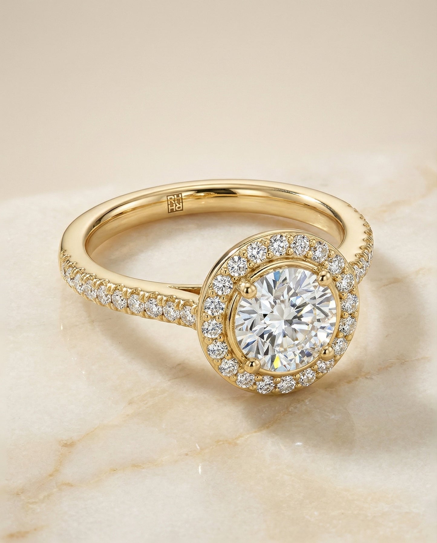 Round Brilliant, Secret Gallery French Pavé Halo, in 18K Yellow Gold – angled view | RockHer