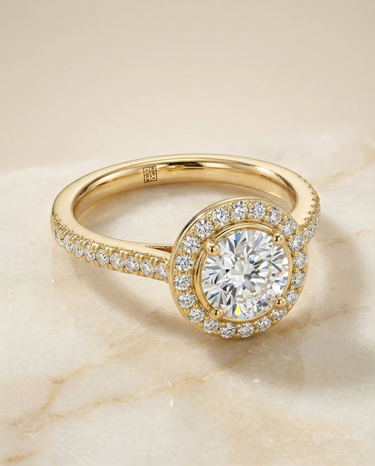 Round Brilliant, Secret Gallery French Pavé Halo, in 18K Yellow Gold – angled view | RockHer