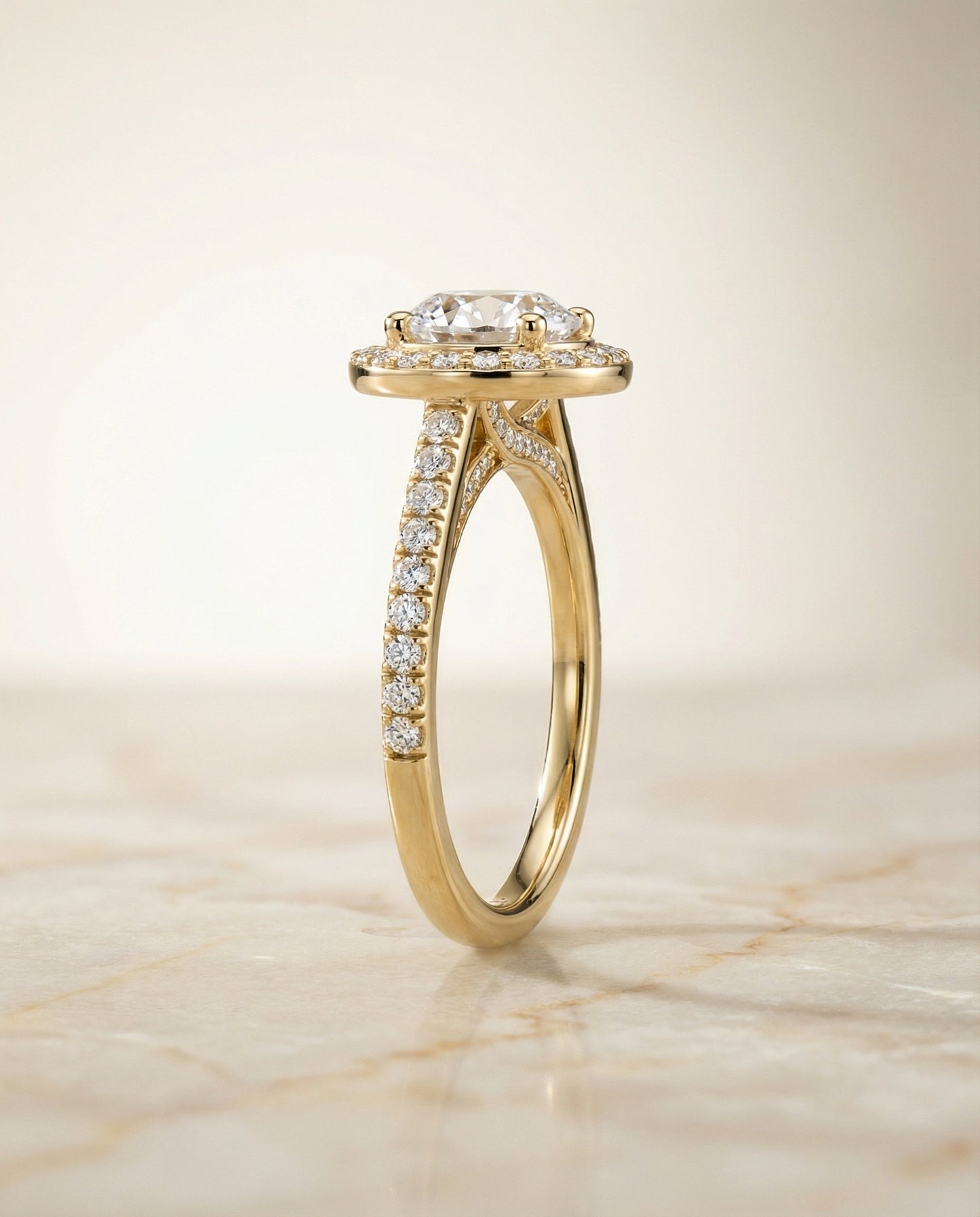 Round Brilliant, Secret Gallery French Pavé Halo, in 18K Yellow Gold – side profile | RockHer