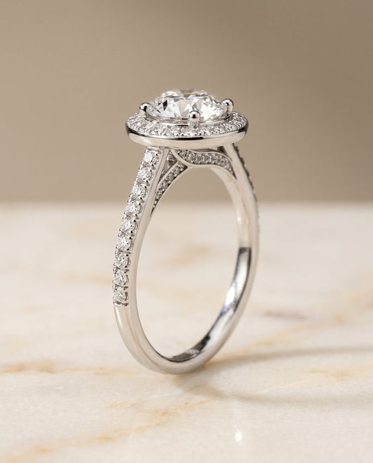 Round Brilliant, Secret Gallery French Pavé Halo, in 18K White Gold – front view | RockHer
