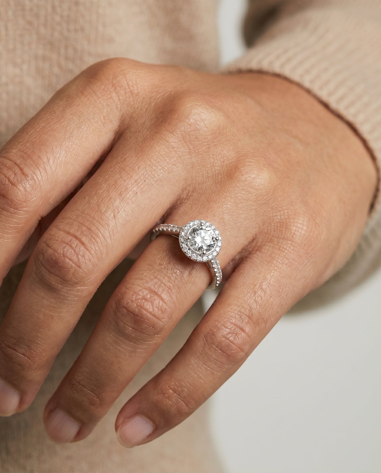 Round Brilliant, Secret Gallery French Pavé Halo, in 18K White Gold – lifestyle shot | RockHer