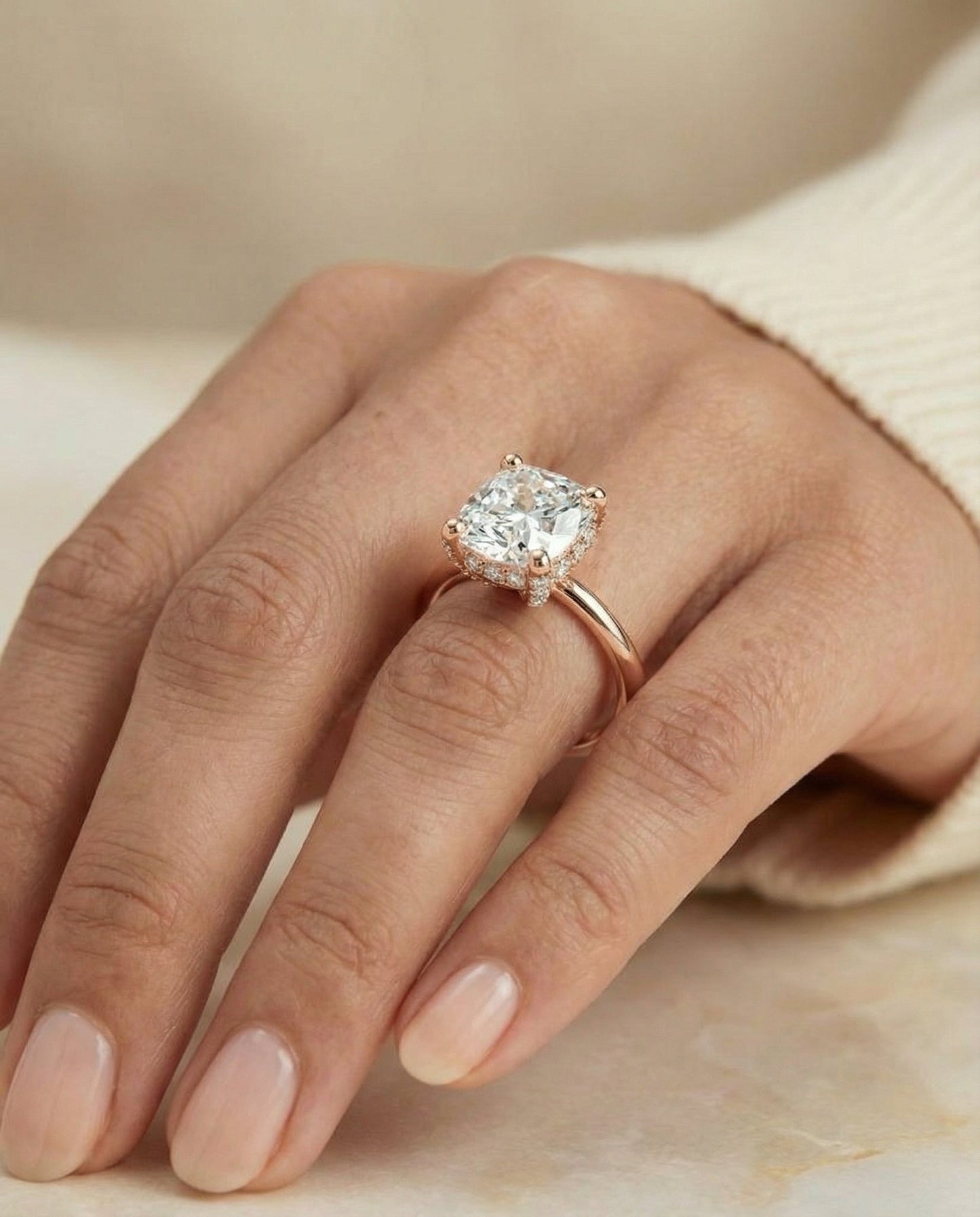 Secret Halo Adorned Prong Solitaire Cushion, in 14K Rose Gold – lifestyle shot | RockHer