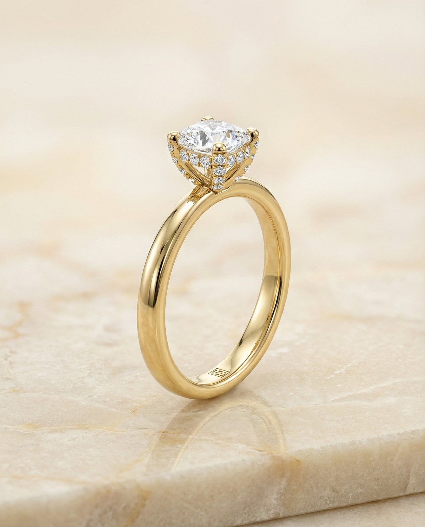 Secret Halo Adorned Prong Solitaire Cushion, in 18K Yellow Gold – front view | RockHer