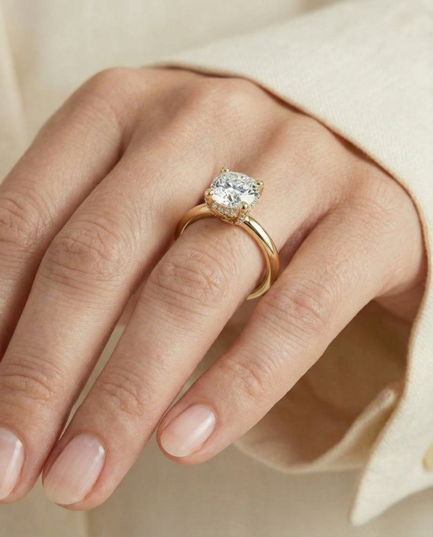 Secret Halo Adorned Prong Solitaire Cushion, in 18K Yellow Gold – lifestyle shot | RockHer