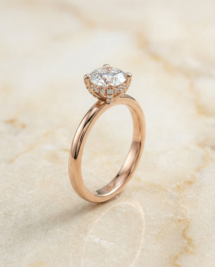 Round Brilliant, Secret Halo Adorned Prong Solitaire, in 14K Rose Gold – front view | RockHer