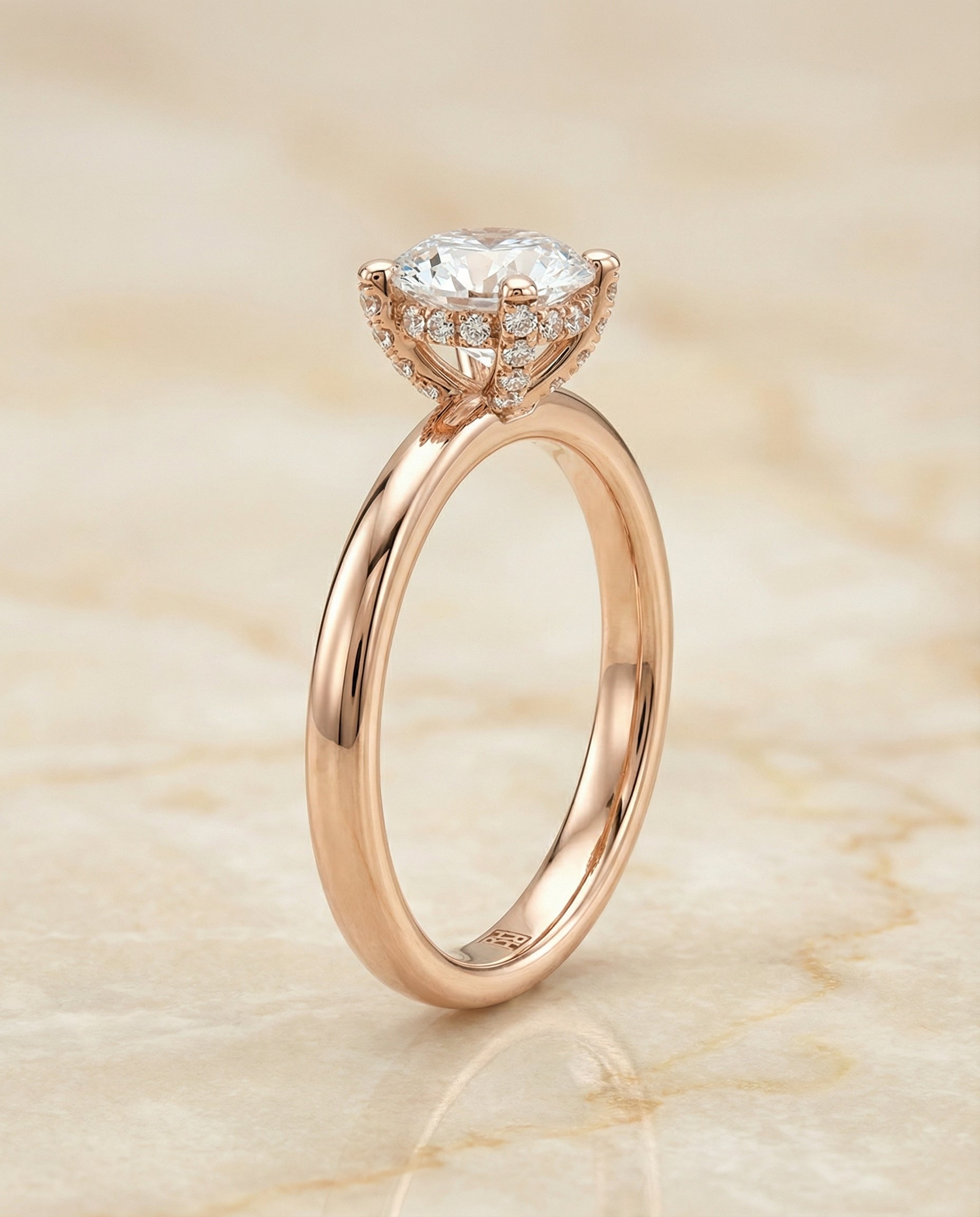 Round Brilliant, Secret Halo Adorned Prong Solitaire, in 14K Rose Gold – side profile | RockHer