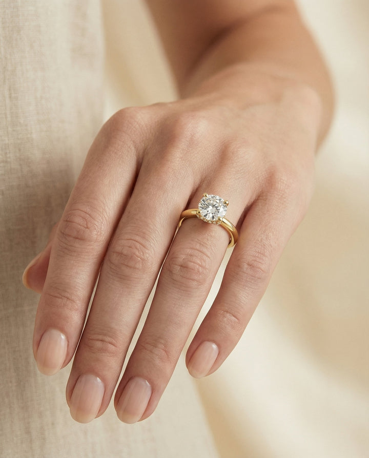 Round Brilliant, Secret Halo Adorned Prong Solitaire, in 18K Yellow Gold – lifestyle shot | RockHer