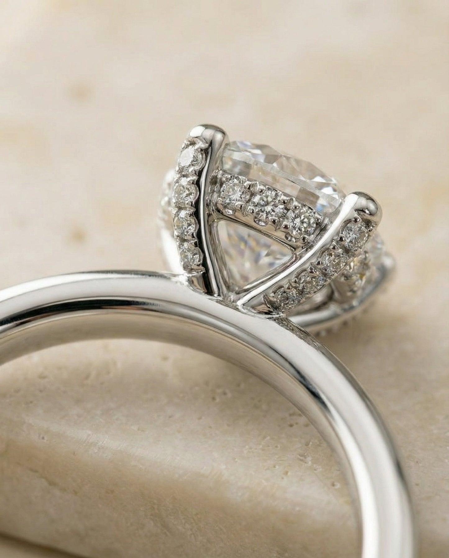Round Brilliant, Secret Halo Adorned Prong Solitaire, in Platinum – detail view | RockHer