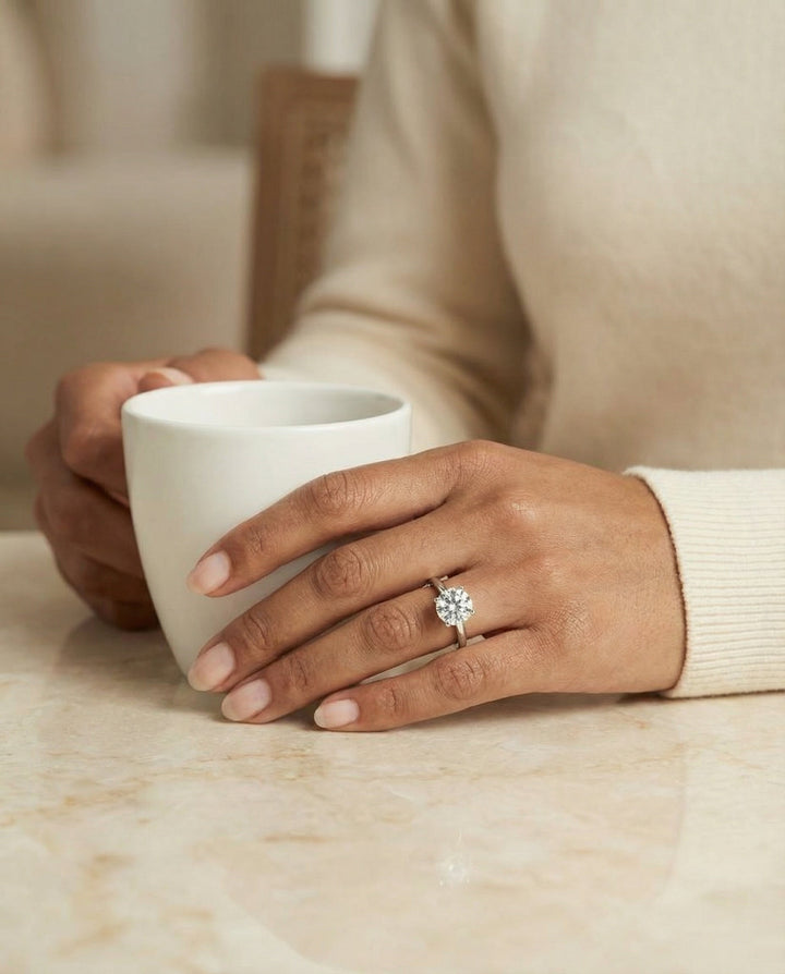 Round Brilliant, Secret Halo Adorned Prong Solitaire, in Platinum – lifestyle shot | RockHer