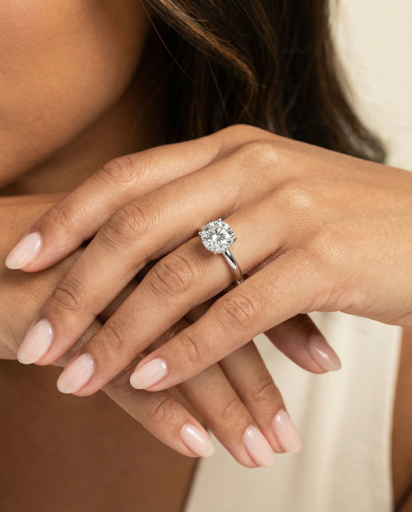 Round Brilliant, Secret Halo Adorned Prong Solitaire, in Platinum – lifestyle shot | RockHer