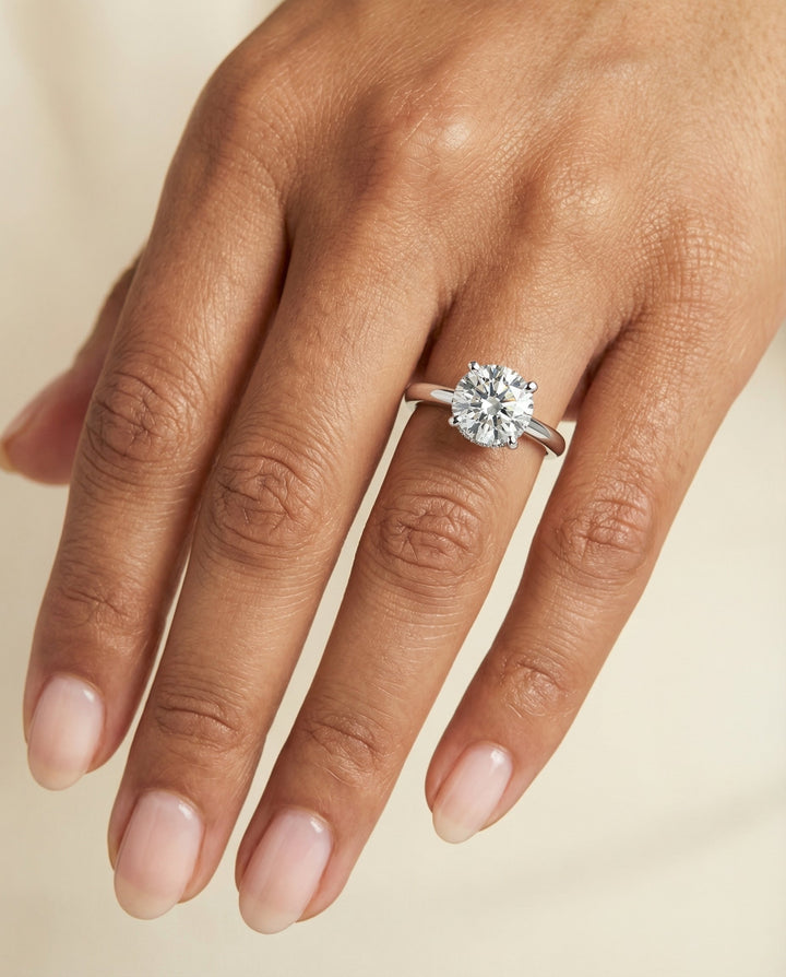 Round Brilliant, Secret Halo Adorned Prong Solitaire, in Platinum – lifestyle shot | RockHer