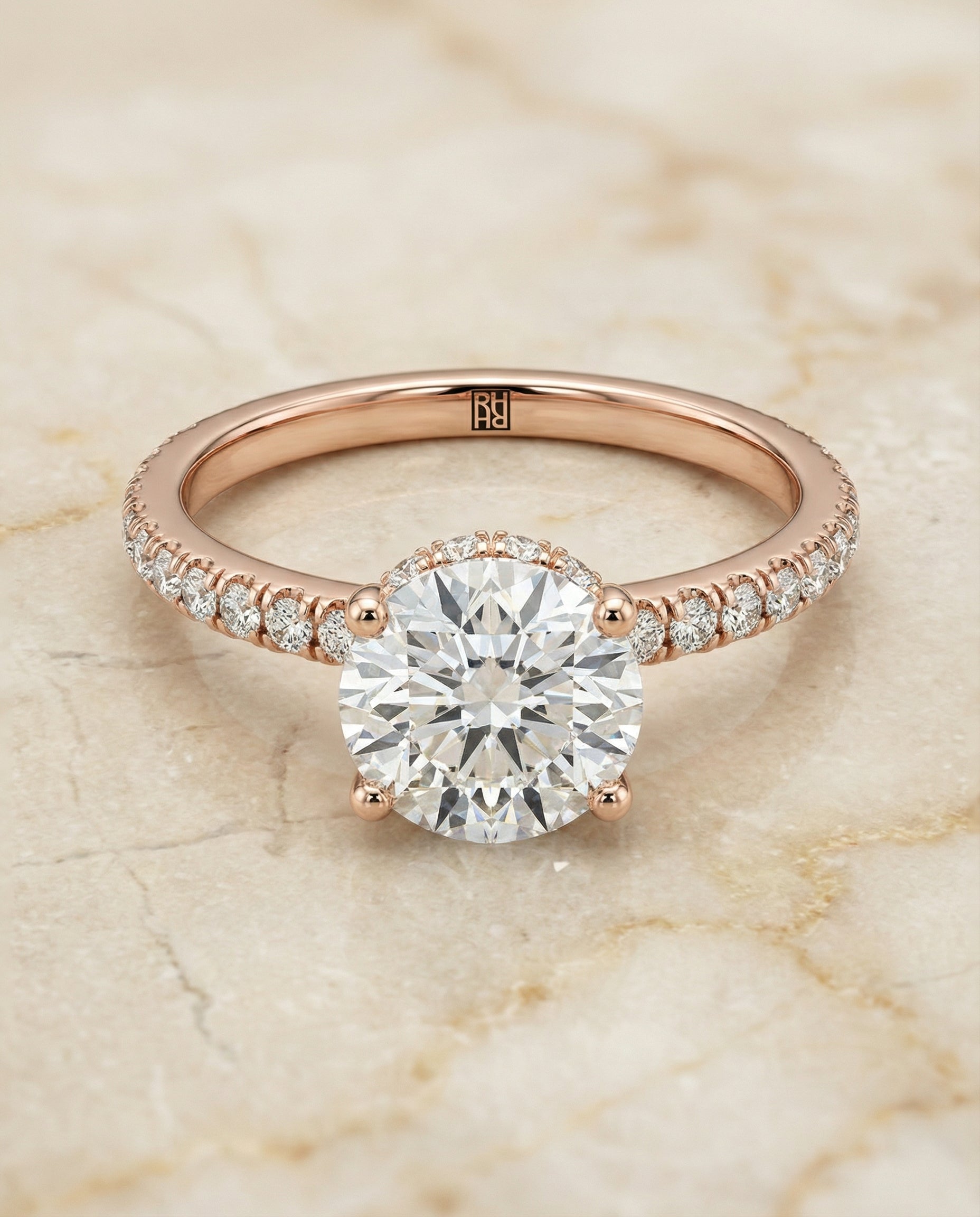 Round Brilliant, Secret Halo French Pavé Solitaire, in 14K Rose Gold, prong setting – angled view | RockHer