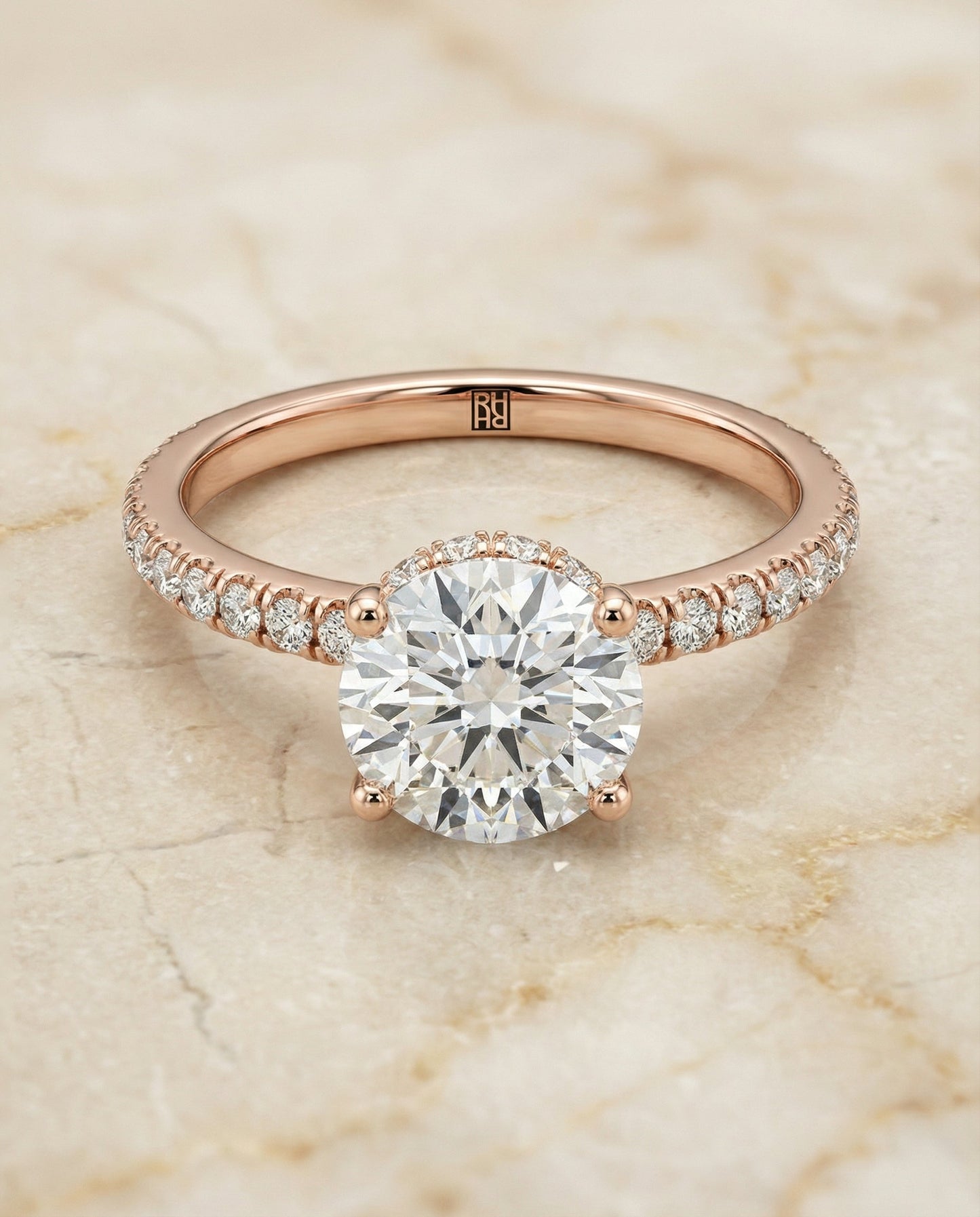 Round Brilliant, Secret Halo French Pavé Solitaire, in 14K Rose Gold, prong setting – angled view | RockHer