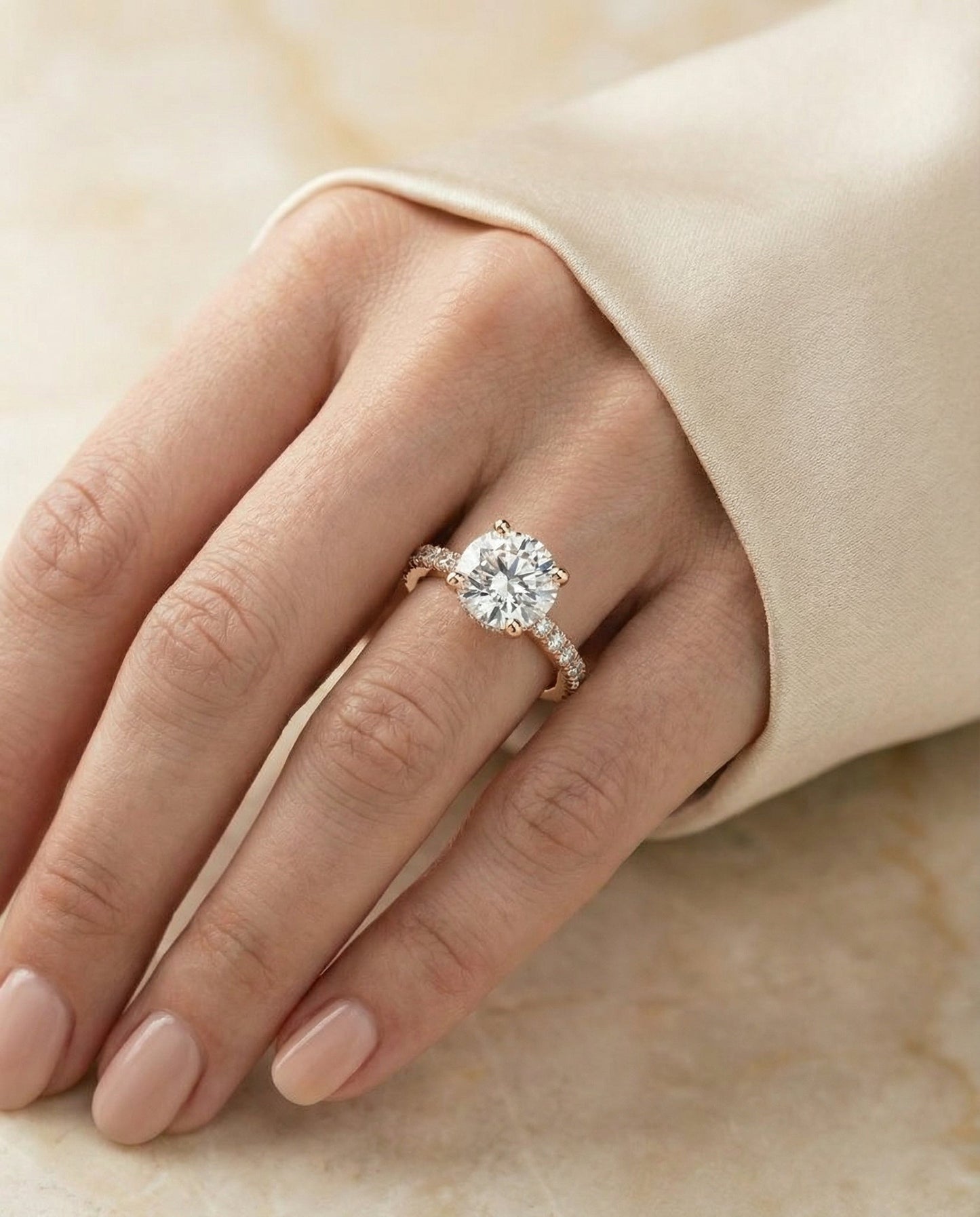 Round Brilliant, Secret Halo French Pavé Solitaire, in 14K Rose Gold, prong setting – lifestyle shot | RockHer