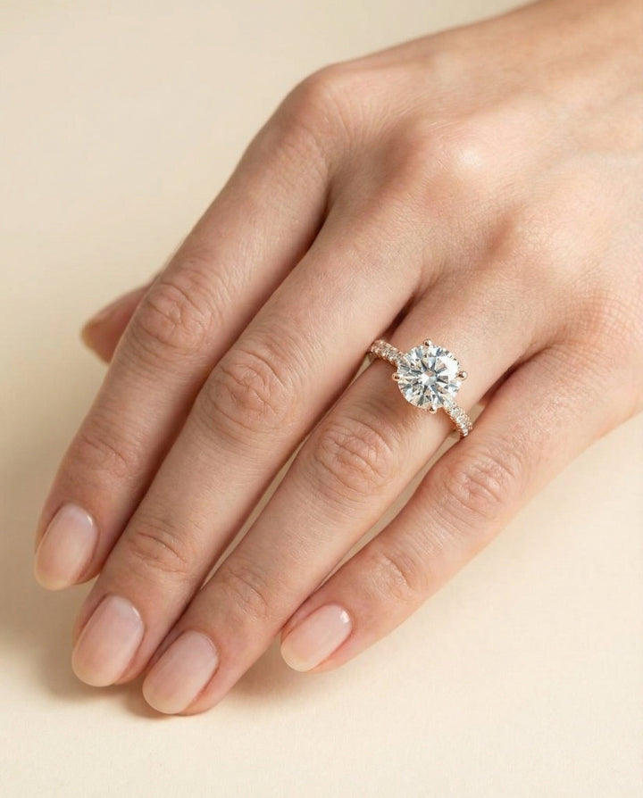 Round Brilliant, Secret Halo French Pavé Solitaire, in 14K Rose Gold, prong setting – lifestyle shot | RockHer