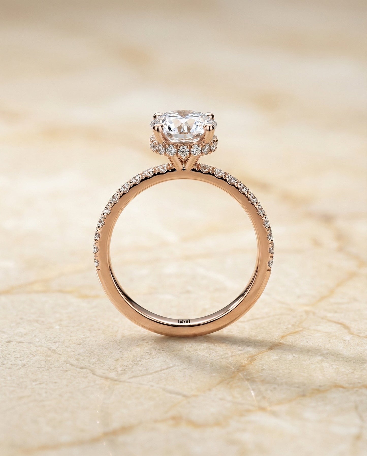 Round Brilliant, Secret Halo French Pavé Solitaire, in 14K Rose Gold, prong setting – side profile | RockHer