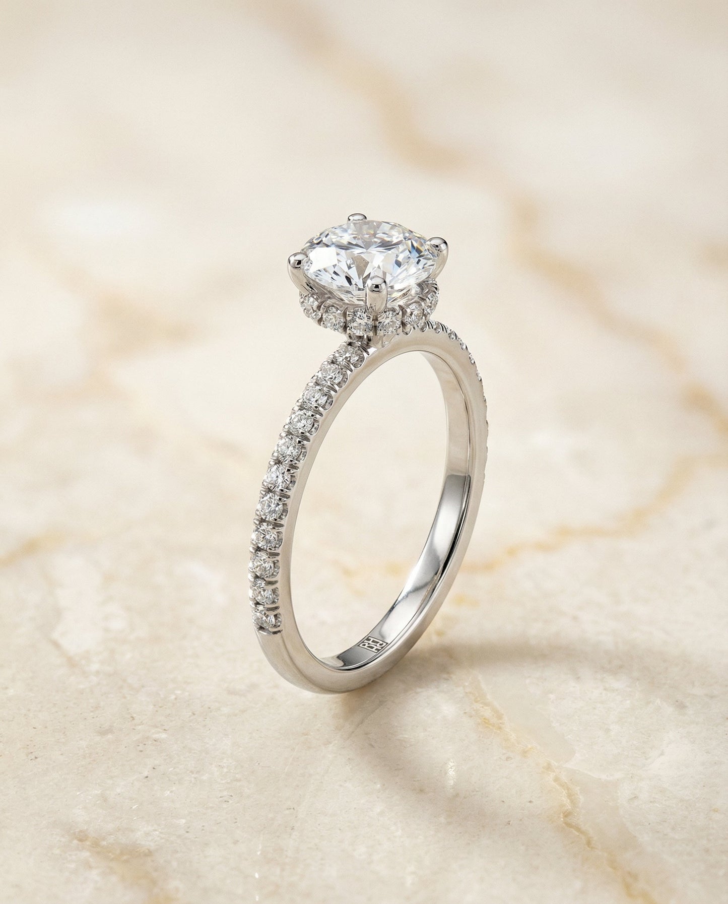 Round Brilliant, Secret Halo French Pavé Solitaire, in Platinum – front view | RockHer