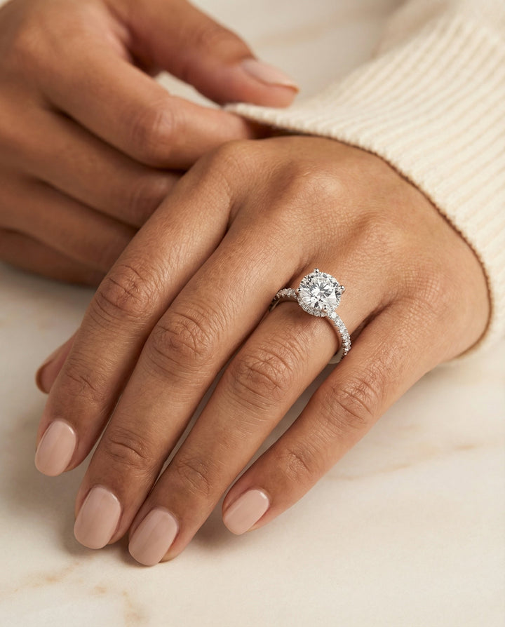 Round Brilliant, Secret Halo French Pavé Solitaire, in Platinum – lifestyle shot | RockHer