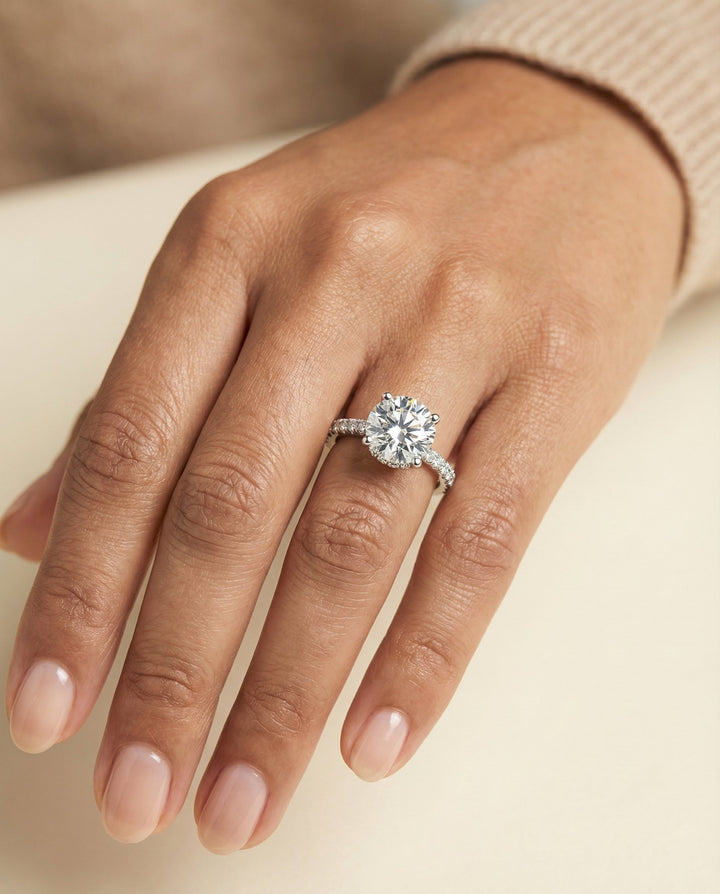 Round Brilliant, Secret Halo French Pavé Solitaire, in Platinum – lifestyle shot | RockHer