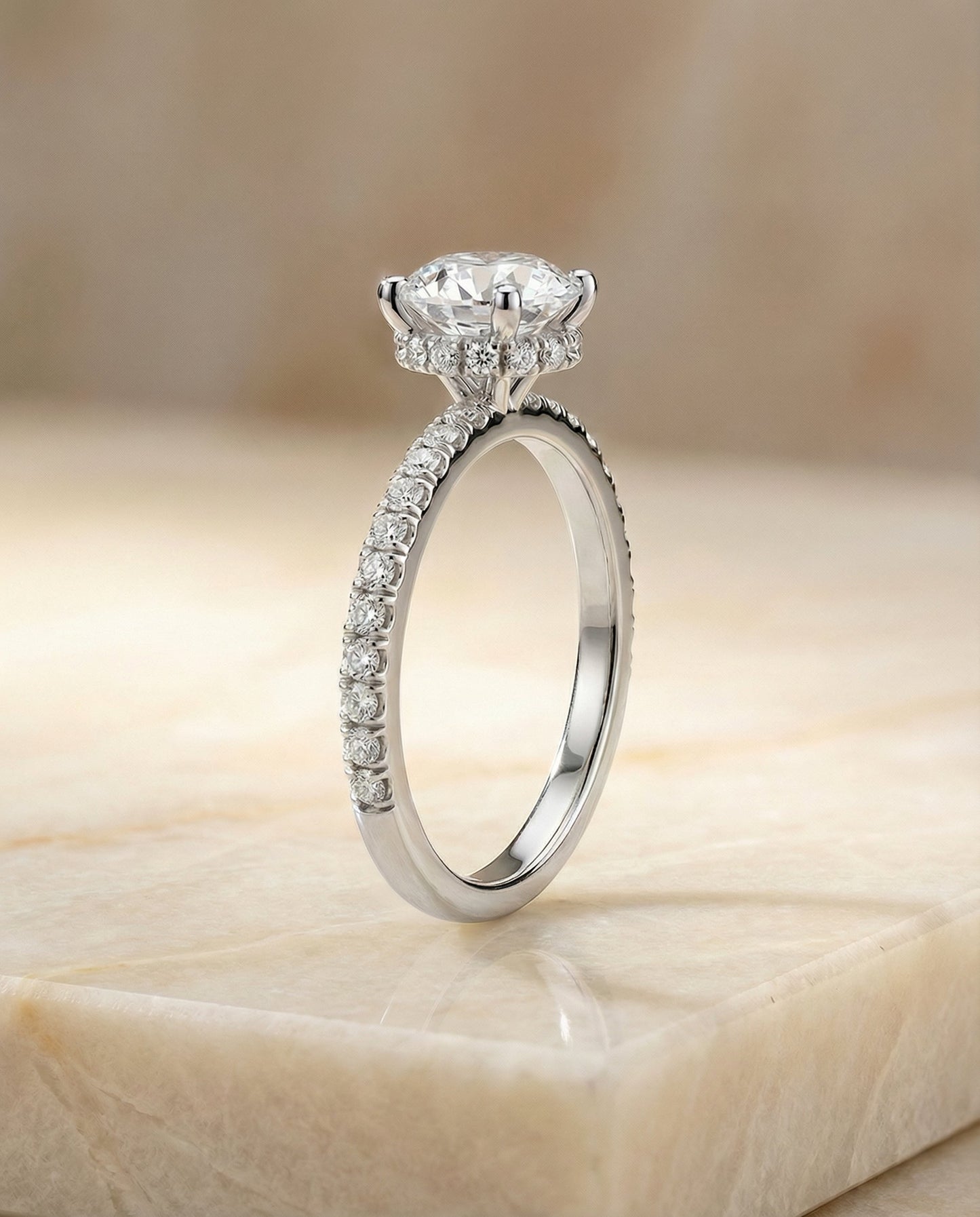 Round Brilliant, Secret Halo French Pavé Solitaire, in Platinum – side profile | RockHer