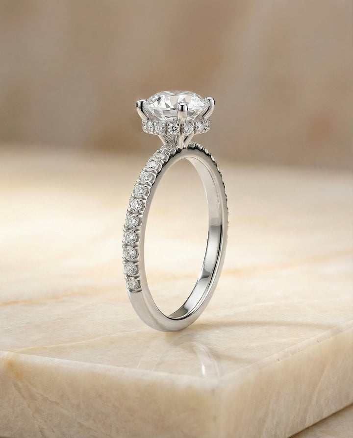 Round Brilliant, Secret Halo French Pavé Solitaire, in Platinum – side profile | RockHer