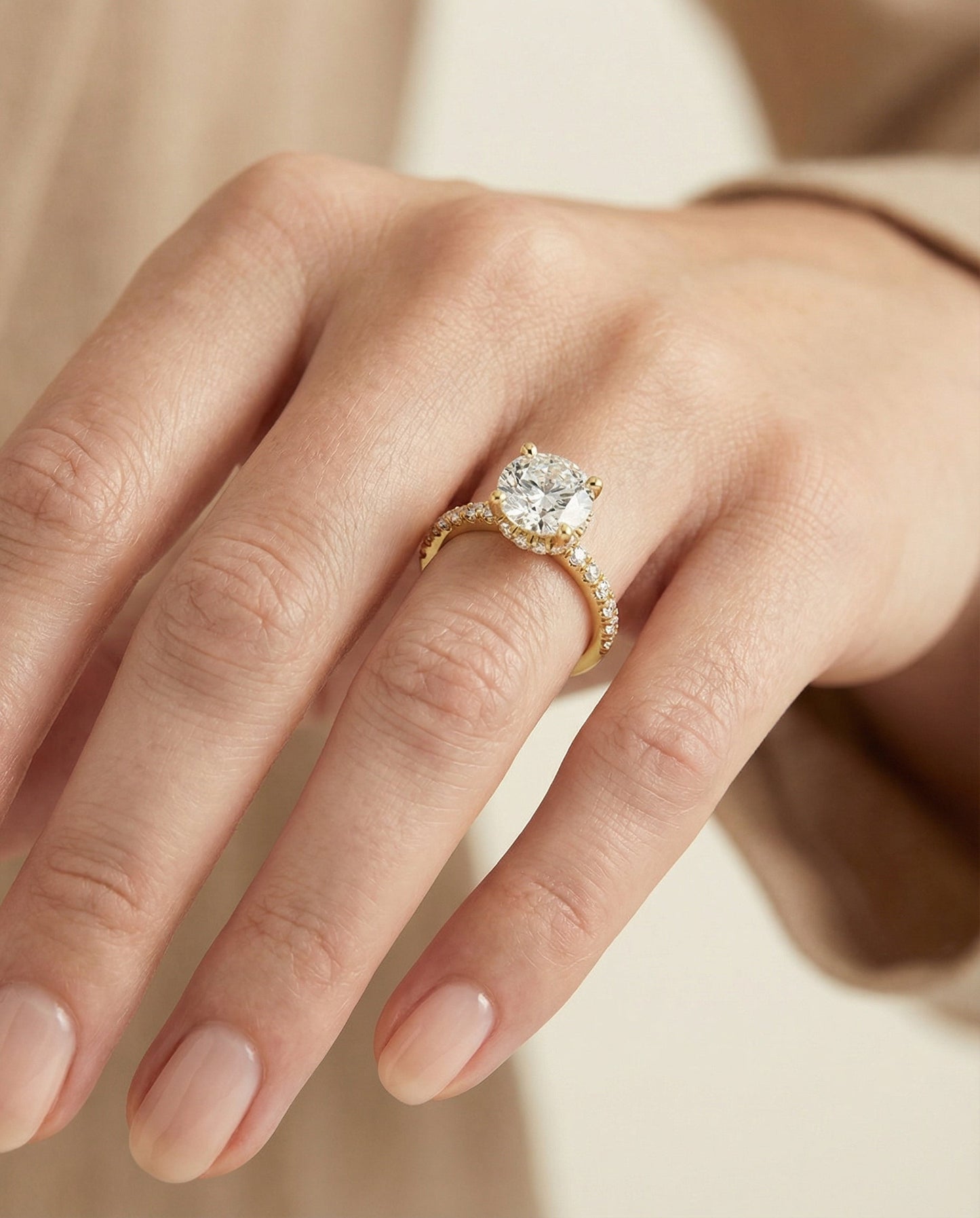 Round Brilliant, Secret Halo French Pavé Solitaire, in 18K Yellow Gold – lifestyle shot | RockHer