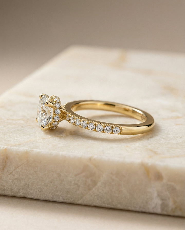 Round Brilliant, Secret Halo French Pavé Solitaire, in 18K Yellow Gold – side profile | RockHer