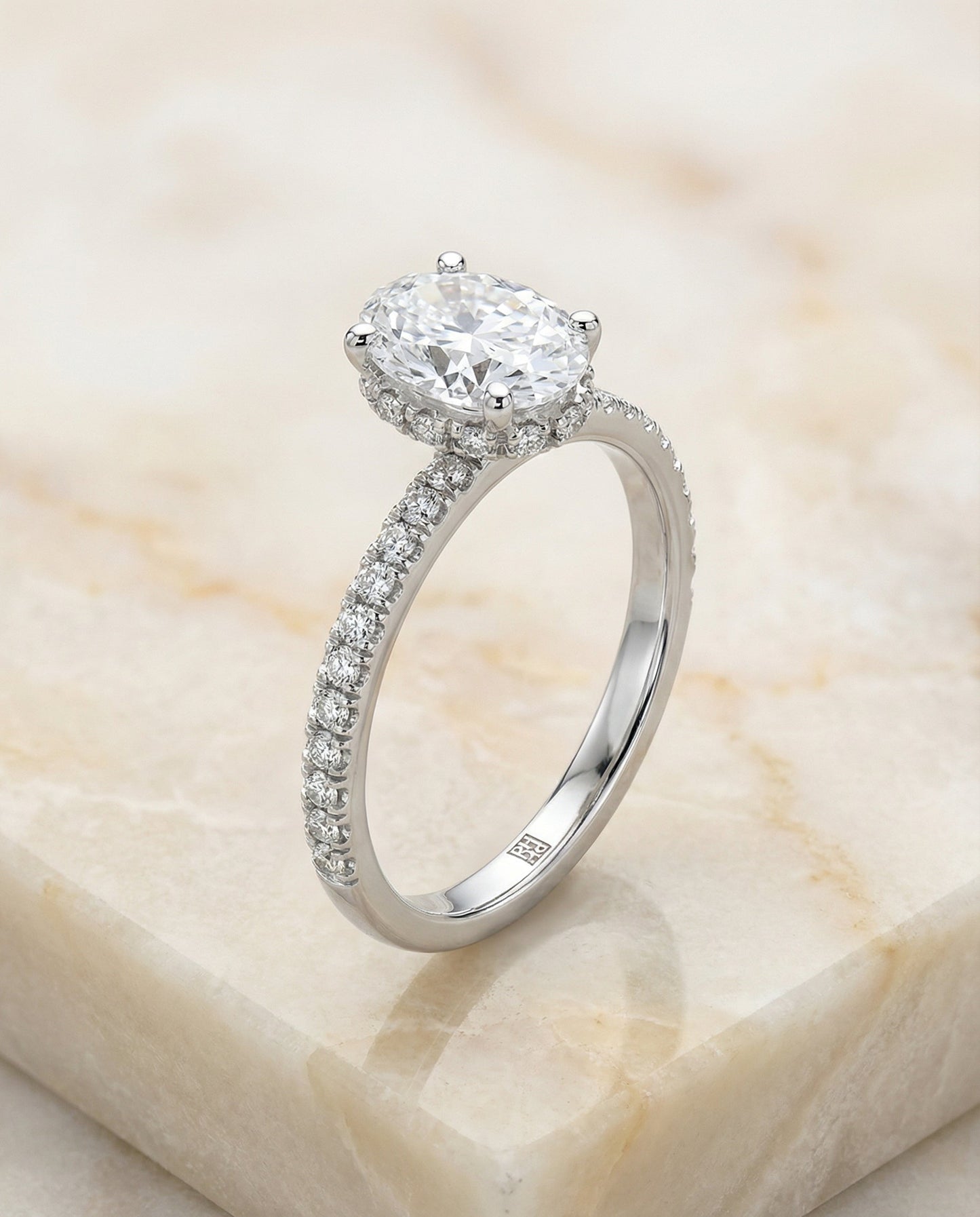 Elliott Select secret halo french pavé solitaire oval oval ring in 14K White Gold — alt angle — RockHer