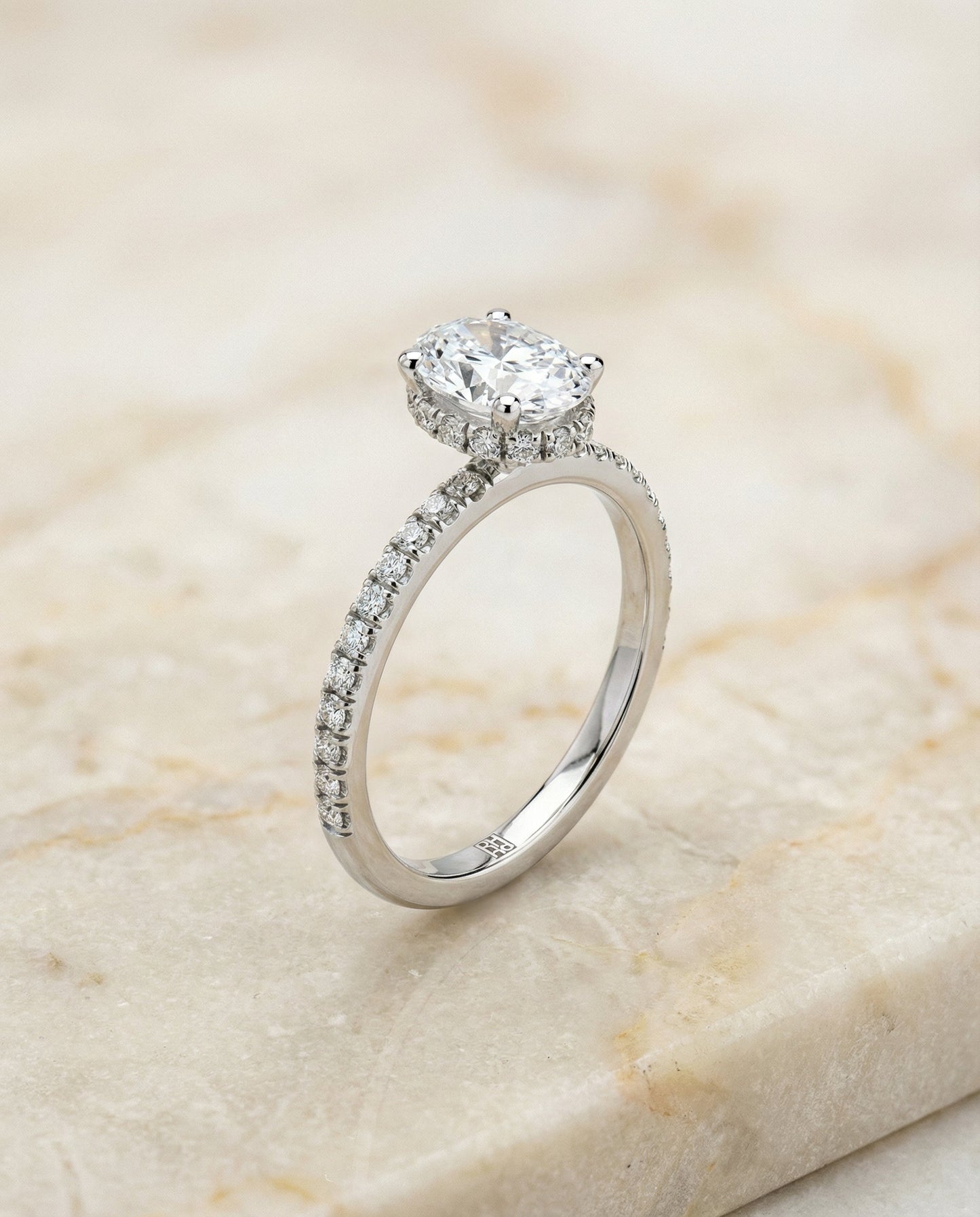 Secret Halo French Pavé Solitaire Oval, in Platinum – front view | RockHer
