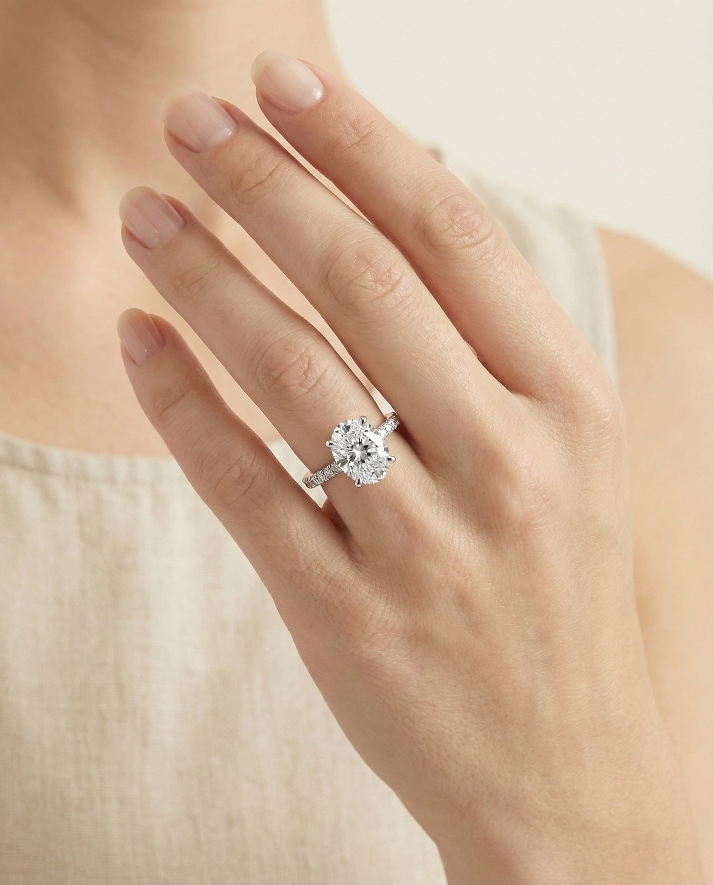 Secret Halo French Pavé Solitaire Oval, in Platinum – lifestyle shot | RockHer